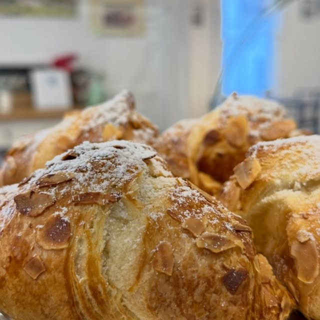 Almond croissants dusted with sugar