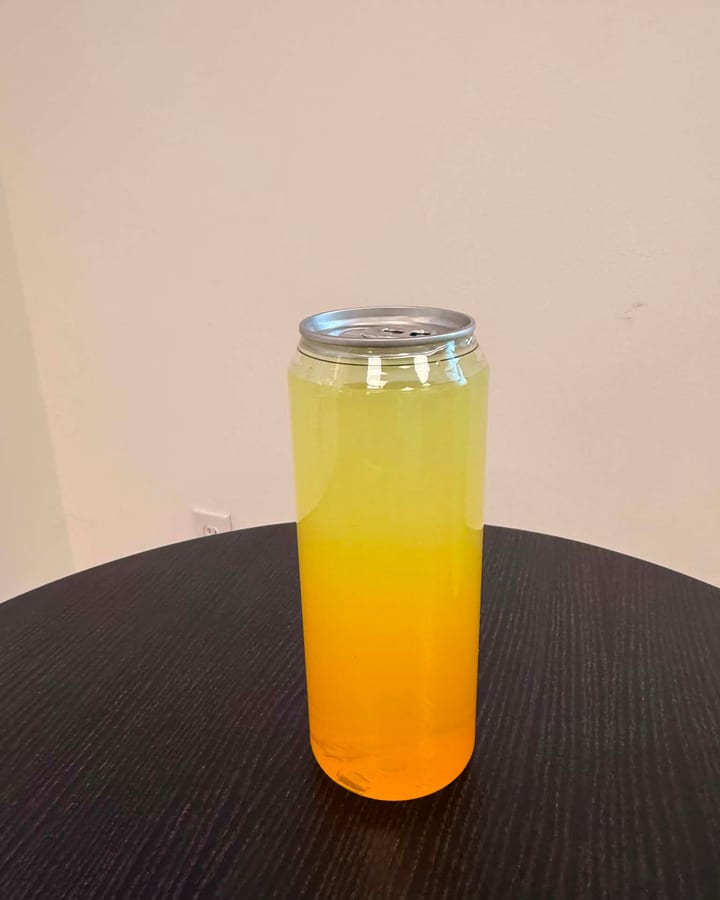 Mango Sunset refresher, a layered yellow and orange iced drink